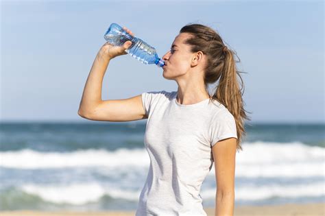 woman tests bottled water|drinking water for women.